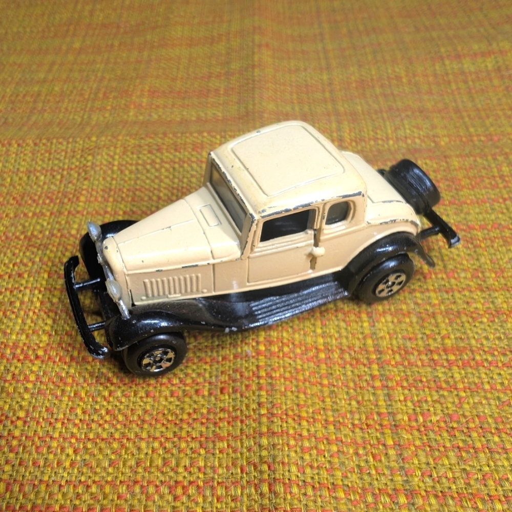 Classic Cream and Black Toy Car
